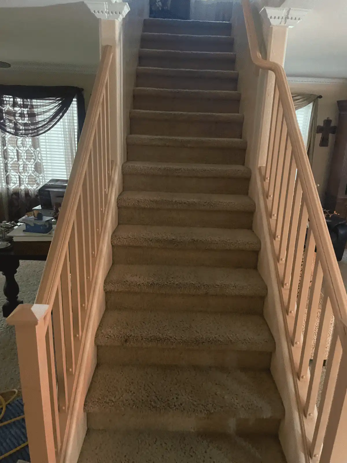 Before and after carpet stairs cleaning in Goodyear living room showing heavy foot traffic patterns removed