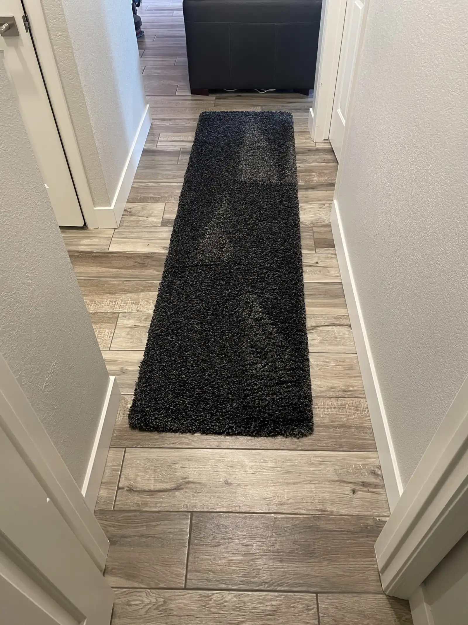 Before and after hallway runner rug cleaning in Litchfield Park home showing soil removed