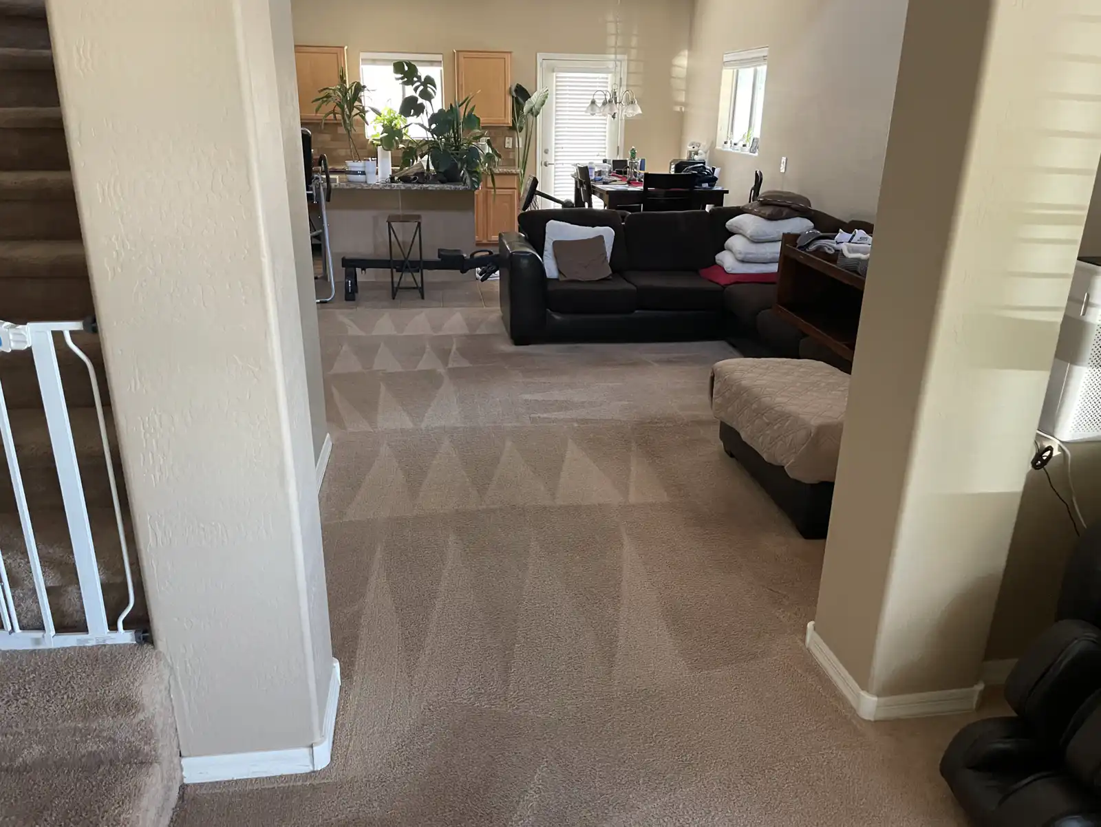 Before and after carpet cleaning in Avondale bedroom showing grayed hallway restored to original beige