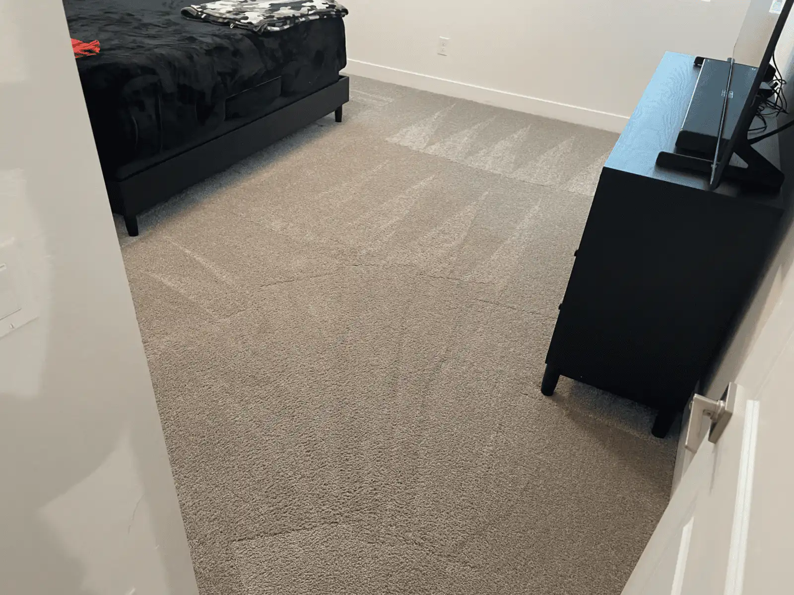 Before and after bedroom carpet cleaning in Litchfield Park home showing traffic patterns cleaned