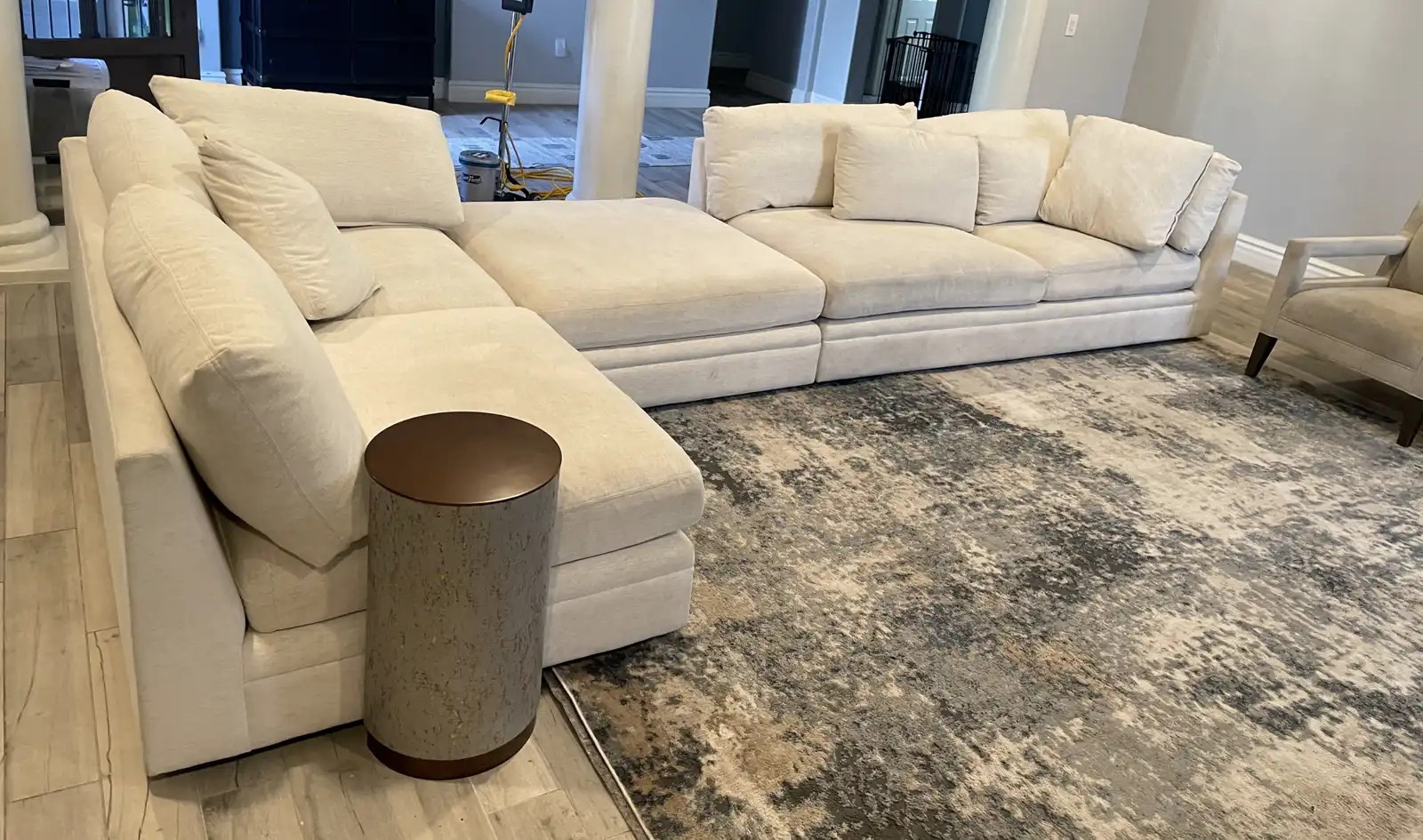 Before and after modular sectional cleaning in Goodyear home showing dog body oil removed from white fabric
