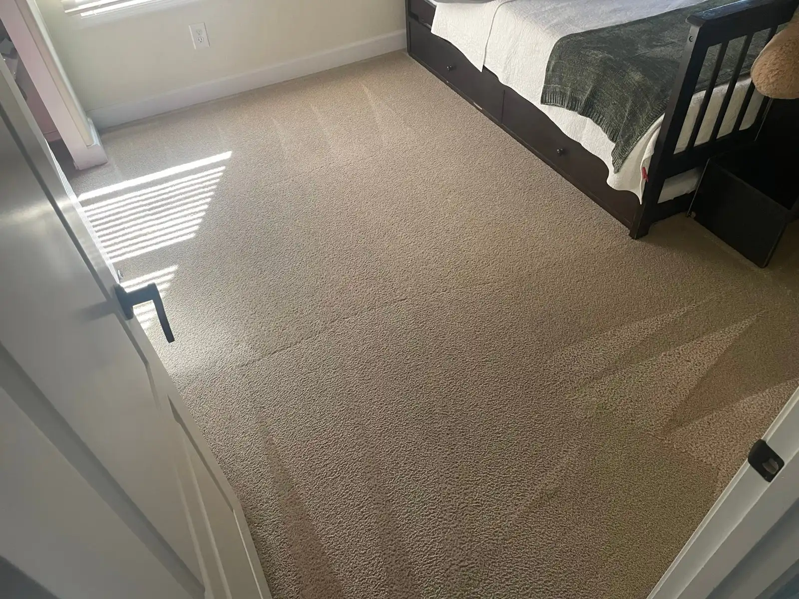 Before and after carpet cleaning in Sun City West home showing restored brightness