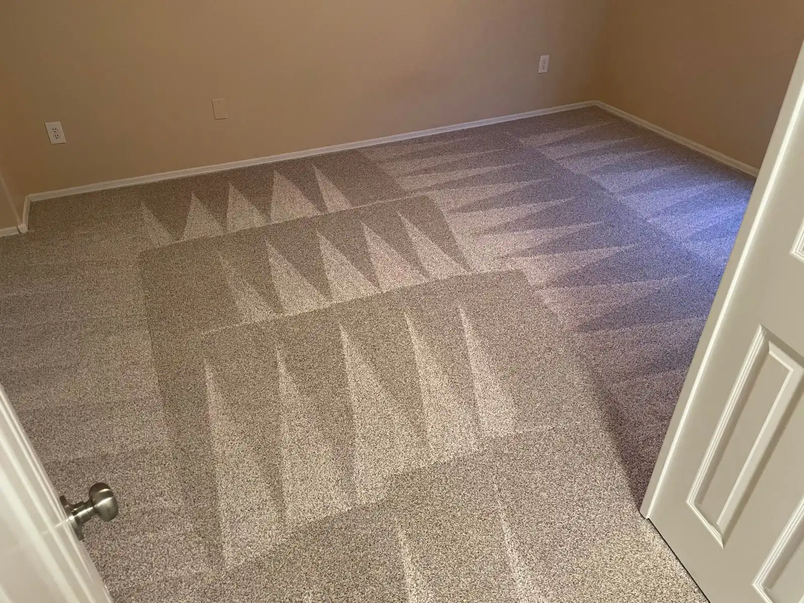 Before and after carpet cleaning in El Mirage home showing traffic soil and particulate removed from master bedroom