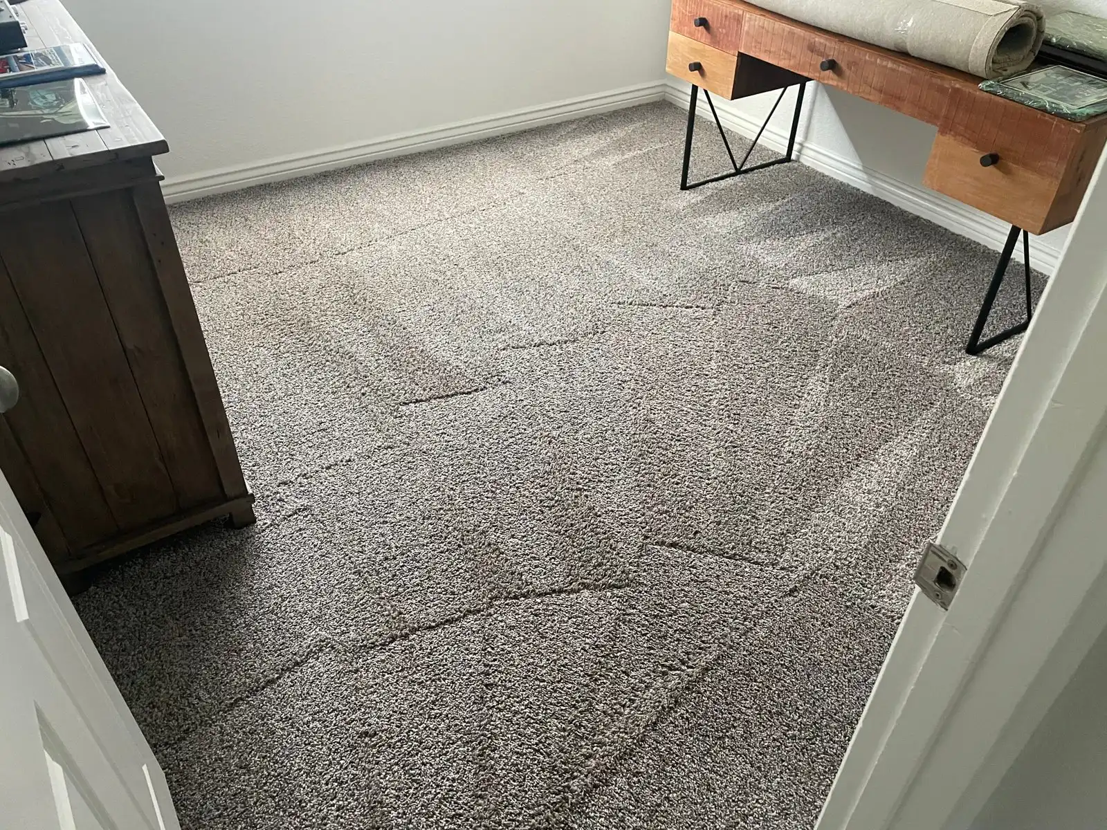 Before and after carpet cleaning in Youngtown home showing older carpet cleaned
