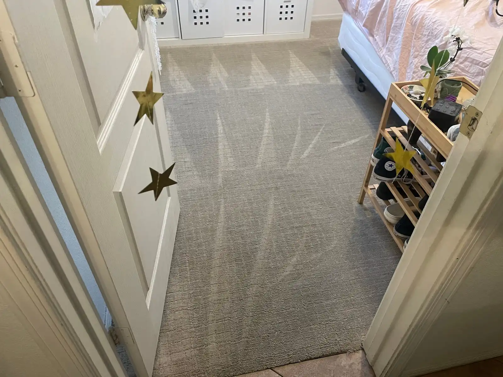 Before and after carpet cleaning in Goodyear home showing heavy entry traffic restored